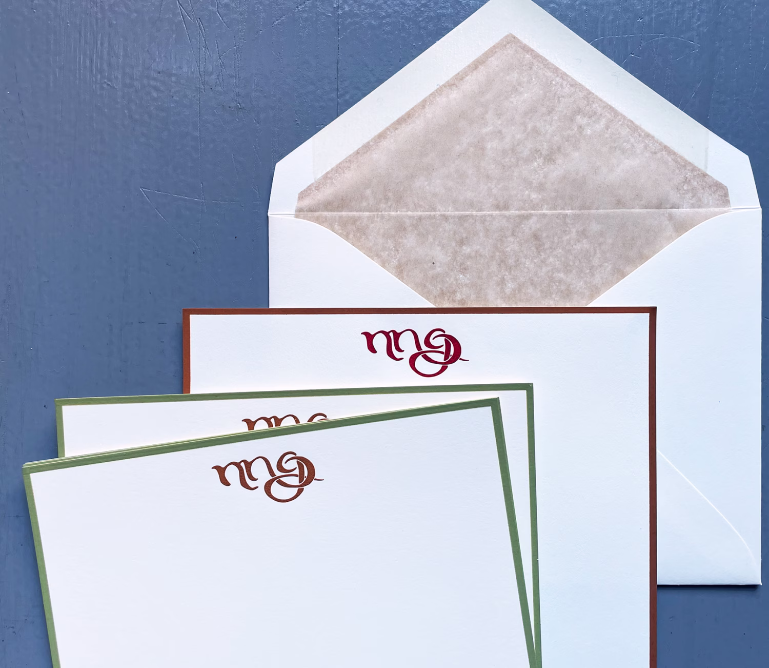 Engraved note and letter sheets, hand bordered, with hand- lined envelopes.